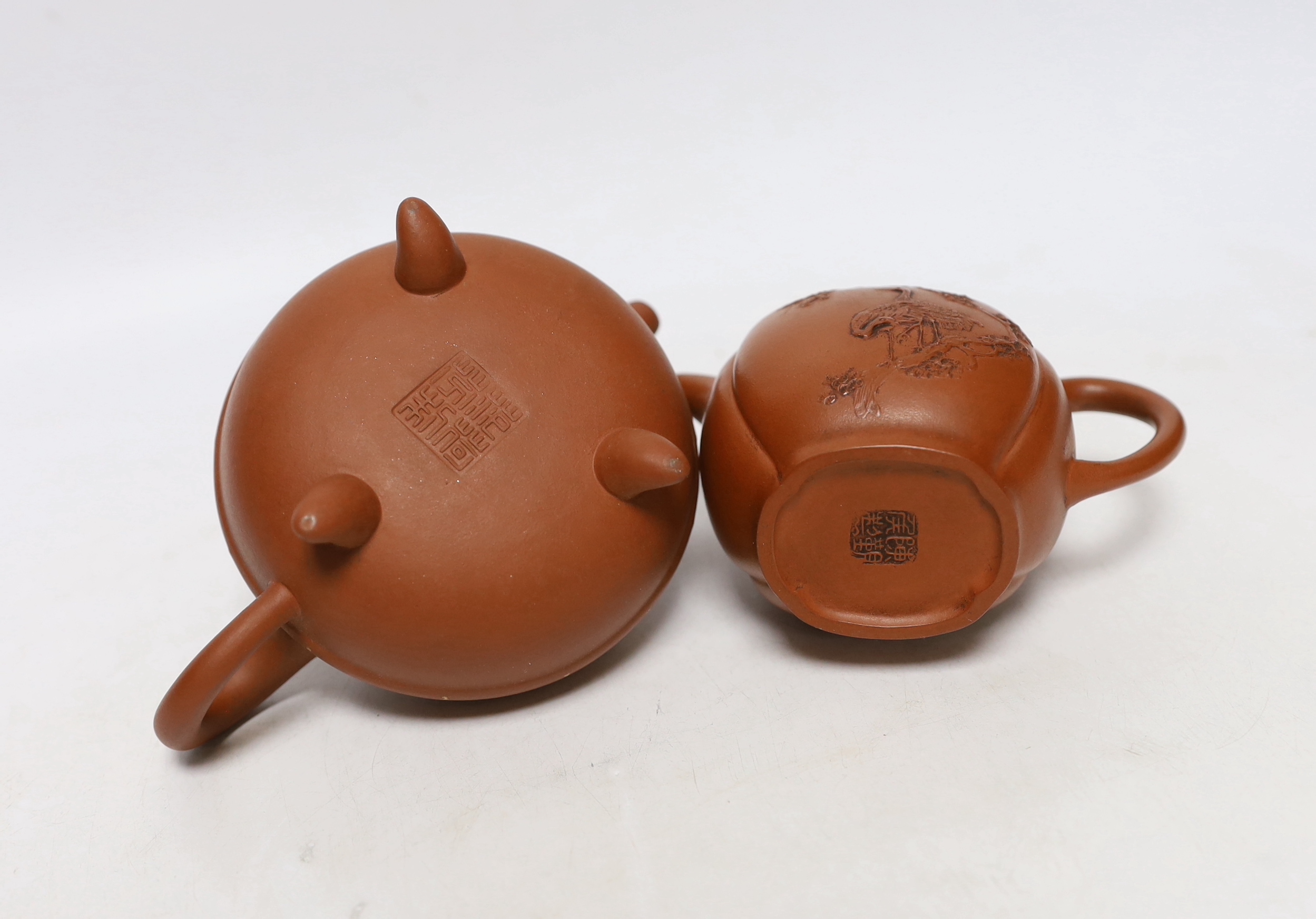 Four Chinese Yixing teapots, one slip decorated with a landscape, tallest 10.5cm